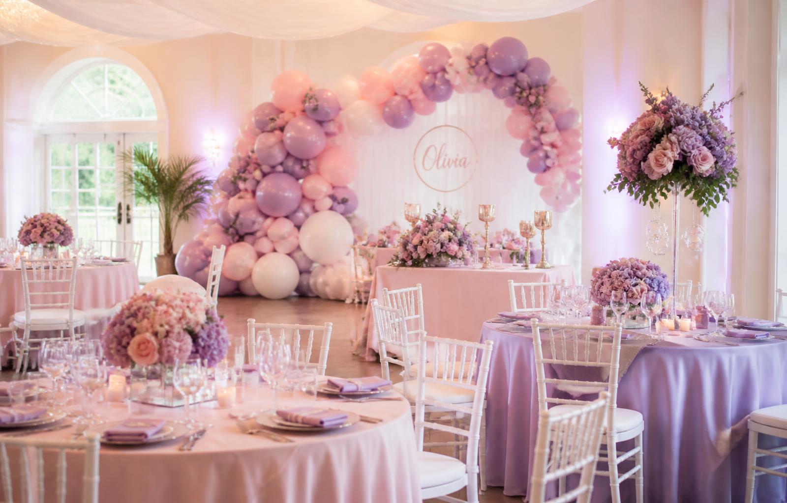 Elegant pink and purple event setup with balloon arch by Anita's All In 1 Event Planning